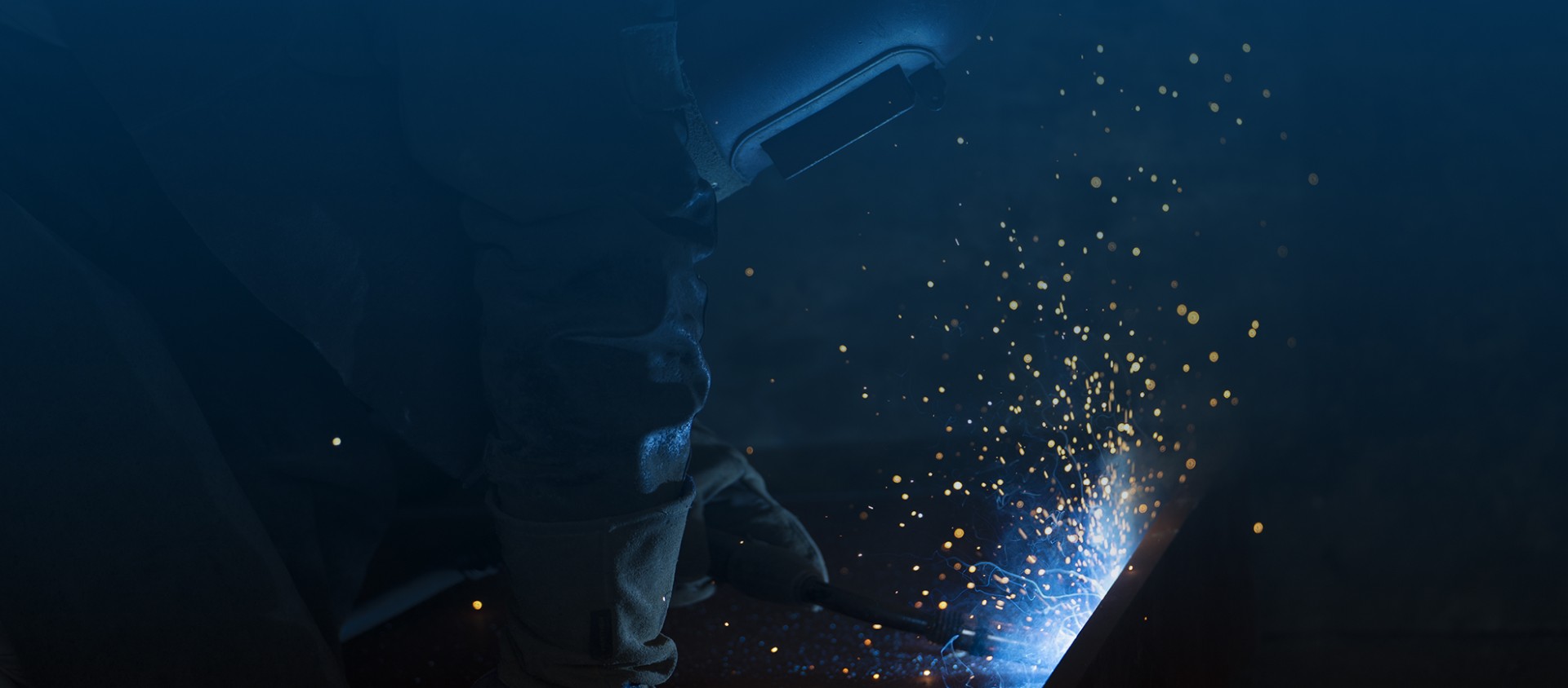Welder carrying out marine steel repair work